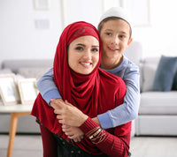 muslim lady with son wearing a burgundy amira hijab lycra with rhinestones rucched cascades